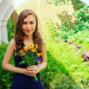 Ruby Martin holidng flowers inside of her garden.